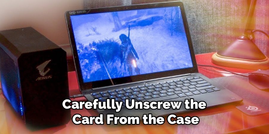 Carefully Unscrew the
Card From the Case